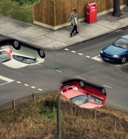 Shows a distorted road intersection