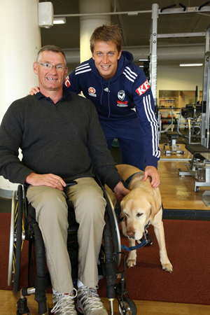 National champion handcyclist Michael Taylor with Melbourne Victory captain Adrian Leijer